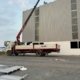 Dịch vụ cẩu giàn pin mặt trời công nghiệp & bồn nước composite 5000L lên mái nhà xưởng cao 20m TPHCM